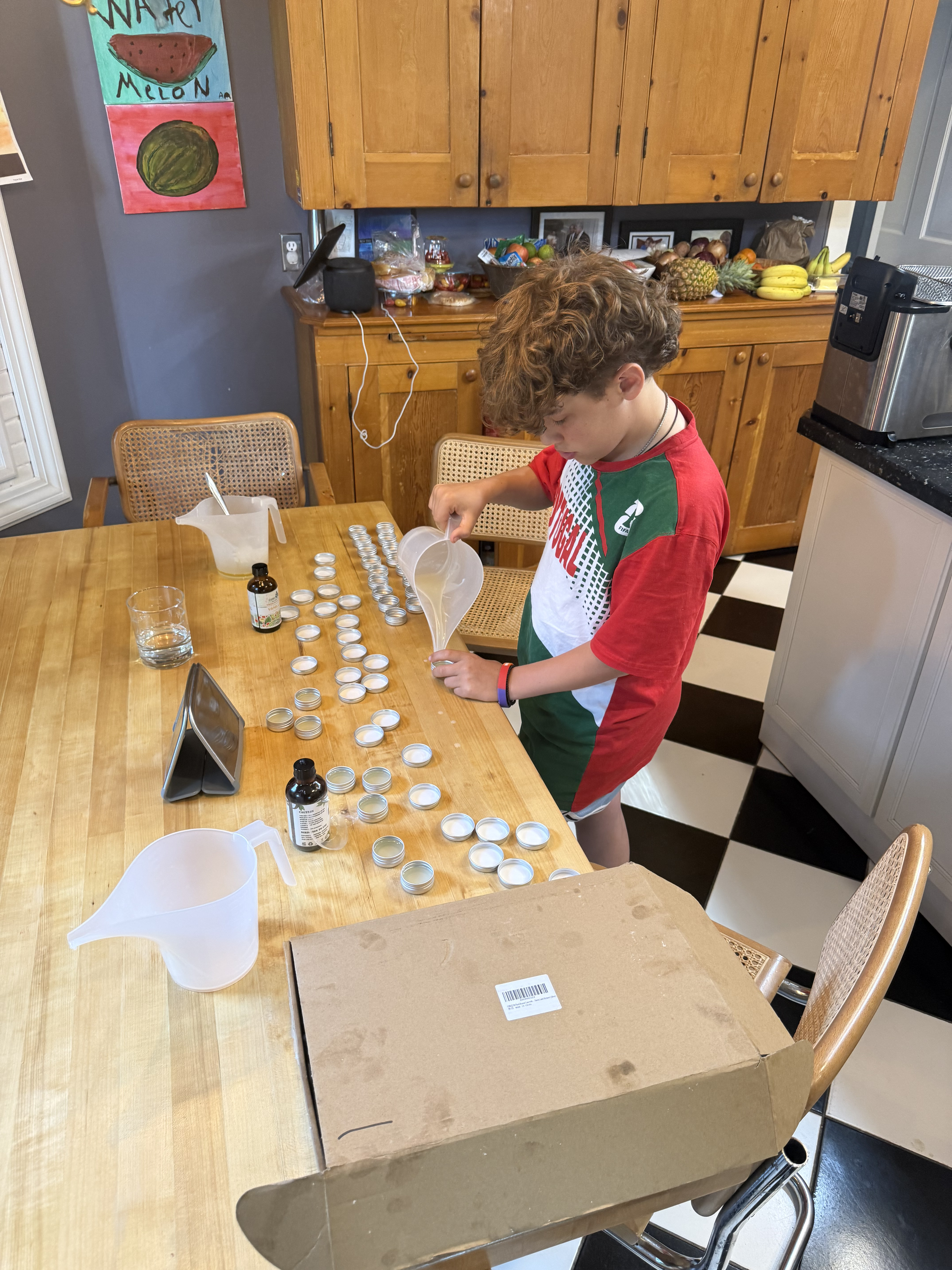 Augie Aibel preparing Bloomify lip balm tins